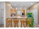 Open-concept kitchen with breakfast bar seating and views into the adjacent kitchen area at 4951 Alita Ter, St Cloud, FL 34769