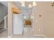 Open-concept kitchen featuring white appliances, wooden cabinets, and access to the dining area at 4951 Alita Ter, St Cloud, FL 34769