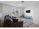 Second floor living space with large window, comfortable seating, and bright natural light at 4951 Alita Ter, St Cloud, FL 34769