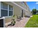 Relaxing brick-paved patio with outdoor seating surrounded by a well-maintained lawn at 4951 Alita Ter, St Cloud, FL 34769