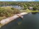 Picturesque aerial view of a lake with a gazebo on a small beach at 5044 Wise Bird Dr, Windermere, FL 34786