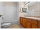 Bathroom featuring a single vanity, bathtub and shower combo, and tile flooring at 5044 Wise Bird Dr, Windermere, FL 34786