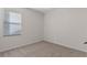 This cozy bedroom has neutral walls, carpeted floors, and a window for natural lighting at 5044 Wise Bird Dr, Windermere, FL 34786