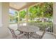 Inviting front porch with outdoor seating, perfect for enjoying serene views and neighborhood ambiance at 5044 Wise Bird Dr, Windermere, FL 34786