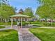 Picturesque gazebo surrounded by lush greenery and brick walkways in a peaceful community setting at 5044 Wise Bird Dr, Windermere, FL 34786