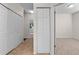 Bright hallway featuring carpeted floors, white doors, trim and natural light from nearby rooms at 5044 Wise Bird Dr, Windermere, FL 34786