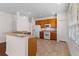 Bright kitchen featuring wooden cabinets, modern appliances, and a breakfast bar for casual dining at 5044 Wise Bird Dr, Windermere, FL 34786