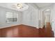 Inviting living room boasts hardwood floors, arched doorways, and a ceiling fan for modern comfort at 5044 Wise Bird Dr, Windermere, FL 34786