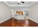 Bright living room area featuring hardwood floors, breakfast bar, and an open view to the kitchen at 5044 Wise Bird Dr, Windermere, FL 34786