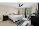 Serene bedroom featuring minimalist decor, a ceiling fan, and a window allowing natural light at 5051 Silver Thistle Ln, St Cloud, FL 34772