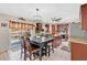 Well-lit kitchen with dark wood cabinets, granite countertops, and stainless steel appliances at 5051 Silver Thistle Ln, St Cloud, FL 34772