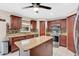Stylish kitchen featuring granite countertops, stainless steel appliances, and a central island at 5051 Silver Thistle Ln, St Cloud, FL 34772