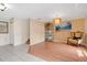 Bright living room boasting tile and wood flooring, an elegant chandelier, and staircase at 5051 Silver Thistle Ln, St Cloud, FL 34772