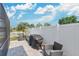 A cozy patio with outdoor seating and a grill, perfect for entertaining in a private fenced-in backyard at 5051 Silver Thistle Ln, St Cloud, FL 34772