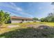 Expansive backyard with a partial lawn and clear views of the rear of the building at 5379 Botany Ct, Orlando, FL 32811