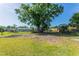 Large backyard with mature shade tree at 5379 Botany Ct, Orlando, FL 32811
