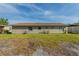 Spacious backyard featuring a lush lawn and clear views of the building's exterior at 5379 Botany Ct, Orlando, FL 32811
