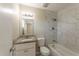 Updated bathroom with modern tiled shower and granite countertop vanity at 5379 Botany Ct, Orlando, FL 32811