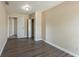 Bright bedroom with white doors and closet, and neutral colored walls at 5379 Botany Ct, Orlando, FL 32811