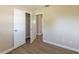 Bedroom featuring neutral walls and vinyl flooring, with closet at 5379 Botany Ct, Orlando, FL 32811