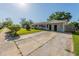 Inviting one-story home featuring a spacious driveway and well-kept front lawn at 5379 Botany Ct, Orlando, FL 32811