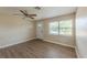 Living room showcases hard-surface floors, a ceiling fan, and neutral paint at 5379 Botany Ct, Orlando, FL 32811