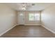 The living room features hard-surface floors, a ceiling fan, and a window at 5379 Botany Ct, Orlando, FL 32811