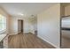 Open-concept living room area next to kitchen features hard surface flooring at 5379 Botany Ct, Orlando, FL 32811