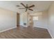 Hard-surface floors and natural lighting create a warm ambiance in this living room at 5379 Botany Ct, Orlando, FL 32811