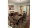 Elegant dining room with a large wooden table, decorative chairs, and a chandelier at 5406 Crepe Myrtle Cir, Kissimmee, FL 34758