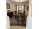 Elegant dining room with a large wooden table, decorative chairs, and a chandelier at 5406 Crepe Myrtle Cir, Kissimmee, FL 34758