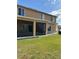 Exterior view of the house shows a back screened in porch at 5406 Crepe Myrtle Cir, Kissimmee, FL 34758