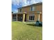 The back exterior of the house features a screened in porch at 5406 Crepe Myrtle Cir, Kissimmee, FL 34758