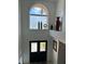 Bright foyer featuring a decorative window above the double front door and elegant decor at 5406 Crepe Myrtle Cir, Kissimmee, FL 34758