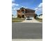 Charming two-story home featuring a spacious driveway and attached two car garage at 5406 Crepe Myrtle Cir, Kissimmee, FL 34758