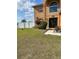 Inviting two-story home with a well-manicured lawn and beautiful landscaping at 5406 Crepe Myrtle Cir, Kissimmee, FL 34758