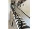 Elegant staircase with decorative iron railings offers a charming transition between floors at 5406 Crepe Myrtle Cir, Kissimmee, FL 34758