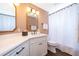 Bright bathroom features double vanity sinks, white cabinetry, and updated fixtures that add a touch of elegance at 5479 Baytowne Pl, Oviedo, FL 32765