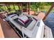 Covered boat dock featuring a stylish boat with comfortable seating and classic design at 5479 Baytowne Pl, Oviedo, FL 32765
