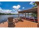 Private boat dock with boat and seating, ideal for lakeside enjoyment at 5479 Baytowne Pl, Oviedo, FL 32765
