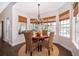 Sun-filled breakfast nook with a table, wicker chairs, and many windows at 5479 Baytowne Pl, Oviedo, FL 32765