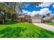 Beautiful two story brick home with manicured lawn and driveway leading to the attached two car garage at 5479 Baytowne Pl, Oviedo, FL 32765
