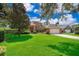 Two story brick home with manicured lawn and an attached two car garage on a sunny day at 5479 Baytowne Pl, Oviedo, FL 32765