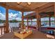 Lakeside gazebo with dining area provides a scenic spot for meals and relaxation at 5479 Baytowne Pl, Oviedo, FL 32765