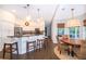 Bright kitchen with stainless steel appliances, white cabinets, an island, and a breakfast nook at 5479 Baytowne Pl, Oviedo, FL 32765