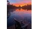 Enjoy breathtaking sunsets from the private dock overlooking the serene lake at 5479 Baytowne Pl, Oviedo, FL 32765