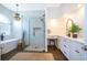 Spa-like bathroom with a freestanding tub, walk-in shower, and a vanity for ultimate relaxation at 5479 Baytowne Pl, Oviedo, FL 32765