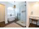 Bright main bathroom with a soaking tub, a glass-enclosed shower, and a vanity area for added convenience at 5479 Baytowne Pl, Oviedo, FL 32765