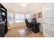 Bright home office featuring a large window, neutral walls, and a ceiling fan at 5479 Baytowne Pl, Oviedo, FL 32765