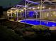 Inviting screened-in pool and patio area perfect for evening relaxation and entertainment at 5479 Baytowne Pl, Oviedo, FL 32765
